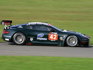 Preview wallpaper aston martin, dbrs9, 2005, black, side view, style, sports, cars, speed, grass