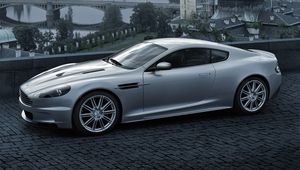 Preview wallpaper aston martin, dbs, 2008, gray metallic, side view, city, bridge, nature