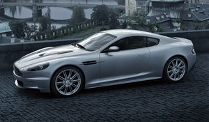 Preview wallpaper aston martin, dbs, 2008, gray metallic, side view, city, bridge, nature