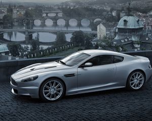 Preview wallpaper aston martin, dbs, 2008, gray metallic, side view, city, bridge, nature