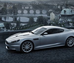 Preview wallpaper aston martin, dbs, 2008, gray metallic, side view, city, bridge, nature