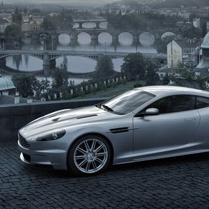 Preview wallpaper aston martin, dbs, 2008, gray metallic, side view, city, bridge, nature