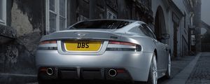 Preview wallpaper aston martin, dbs, 2008, gray metallic, rear view, style, cars, street, building