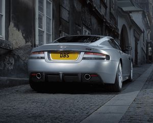 Preview wallpaper aston martin, dbs, 2008, gray metallic, rear view, style, cars, street, building