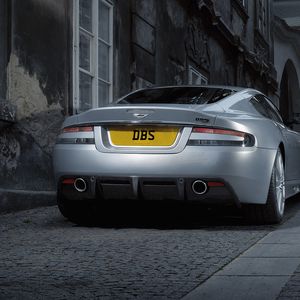 Preview wallpaper aston martin, dbs, 2008, gray metallic, rear view, style, cars, street, building