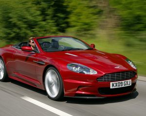 Preview wallpaper aston martin, dbs, 2009, red, side view, speed, trees, cars