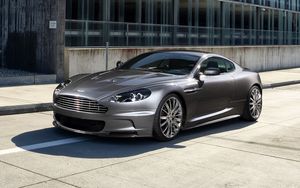 Preview wallpaper aston martin, dbs, 2009, gray, side view, sports, building