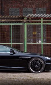 Preview wallpaper aston martin, dbs, 2009, black, side view, cars, building