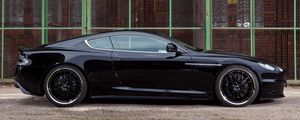 Preview wallpaper aston martin, dbs, 2009, black, side view, cars, building