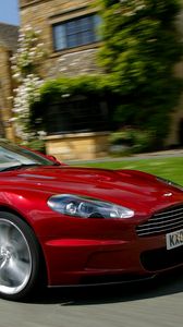 Preview wallpaper aston martin, dbs, 2009, red, side view, cars, houses, grass