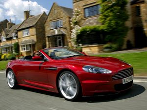 Preview wallpaper aston martin, dbs, 2009, red, side view, cars, houses, grass