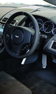 Preview wallpaper aston martin, dbs, 2010, black, salon, interior, steering wheel, speedometer