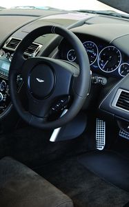 Preview wallpaper aston martin, dbs, 2010, black, salon, interior, steering wheel, speedometer