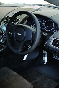 Preview wallpaper aston martin, dbs, 2010, black, salon, interior, steering wheel, speedometer