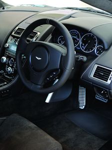 Preview wallpaper aston martin, dbs, 2010, black, salon, interior, steering wheel, speedometer