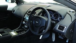 Preview wallpaper aston martin, dbs, 2010, black, salon, interior, steering wheel, speedometer