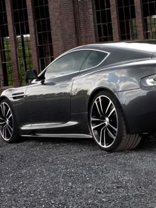 Preview wallpaper aston martin, dbs, 2010, black, side view, style, building