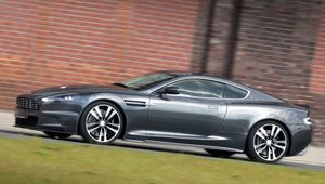 Preview wallpaper aston martin, dbs, 2010, gray, side view, style, grass