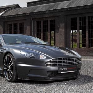 Preview wallpaper aston martin, dbs, 2010, gray metallic, front view, cars, building