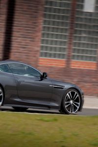 Preview wallpaper aston martin, dbs, 2010, gray, side view, cars, grass, building