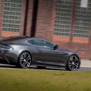 Preview wallpaper aston martin, dbs, 2010, gray, side view, cars, grass, building