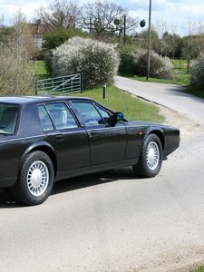 Preview wallpaper aston martin, lagonda, 1987, black, side view, cars, nature