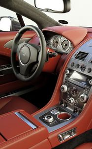 Preview wallpaper aston martin, rapide, 2009, red, salon, interior, steering wheel, speedometer