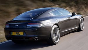 Preview wallpaper aston martin, rapide, 2009, gray, side view, rear car, speed