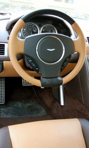 Preview wallpaper aston martin, rapide, 2011, brown, salon, interior, steering wheel, speedometer
