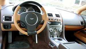 Preview wallpaper aston martin, rapide, 2011, brown, salon, interior, steering wheel, speedometer