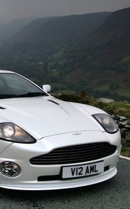 Preview wallpaper aston martin, v12, vanquish, 2004, white, front view, cars, mountains