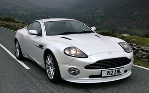 Preview wallpaper aston martin, v12, vanquish, 2004, white, front view, cars, mountains