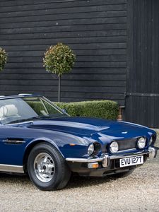 Preview wallpaper aston martin, v8, 1977, blue, side view, cabriolet, building