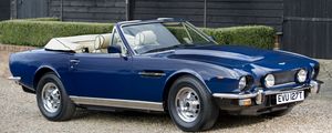 Preview wallpaper aston martin, v8, 1977, blue, side view, cabriolet, building