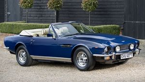 Preview wallpaper aston martin, v8, 1977, blue, side view, cabriolet, building