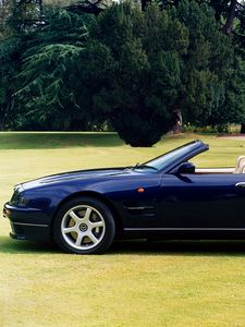 Preview wallpaper aston martin, v8, 1997, blue, side view, cabriolet, house, nature