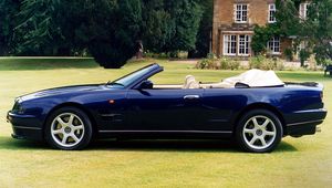 Preview wallpaper aston martin, v8, 1997, blue, side view, cabriolet, house, nature