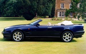 Preview wallpaper aston martin, v8, 1997, blue, side view, cabriolet, house, nature