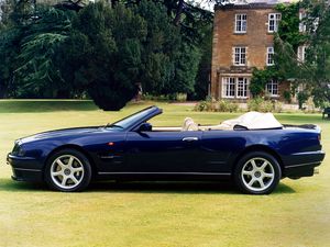 Preview wallpaper aston martin, v8, 1997, blue, side view, cabriolet, house, nature