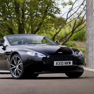 Preview wallpaper aston martin, v8, vantage, 2010, black, front view, car, tree