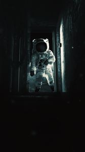 Preview wallpaper astronaut, cosmonaut, gravity, spacesuit, door, dark