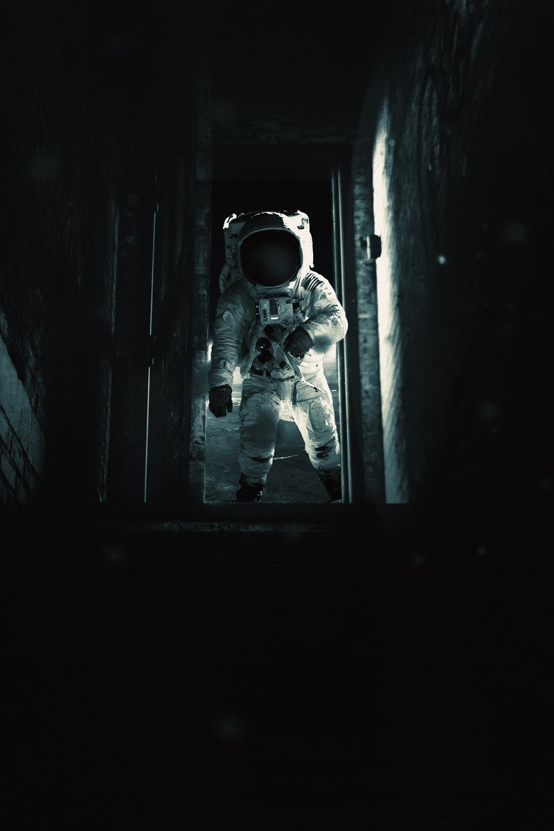 Download wallpaper 800x1200 astronaut, cosmonaut, gravity, spacesuit, door,  dark iphone 4s/4 for parallax hd background