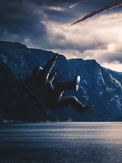 240x320 Wallpaper astronaut, cosmonaut, space suit, fall, photoshop, lake, mountains, dark