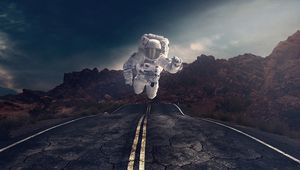 Preview wallpaper astronaut, gravity, road, asphalt, rocks, stones