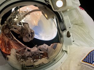 Preview wallpaper astronaut, reflection, helmet, spacesuit, space