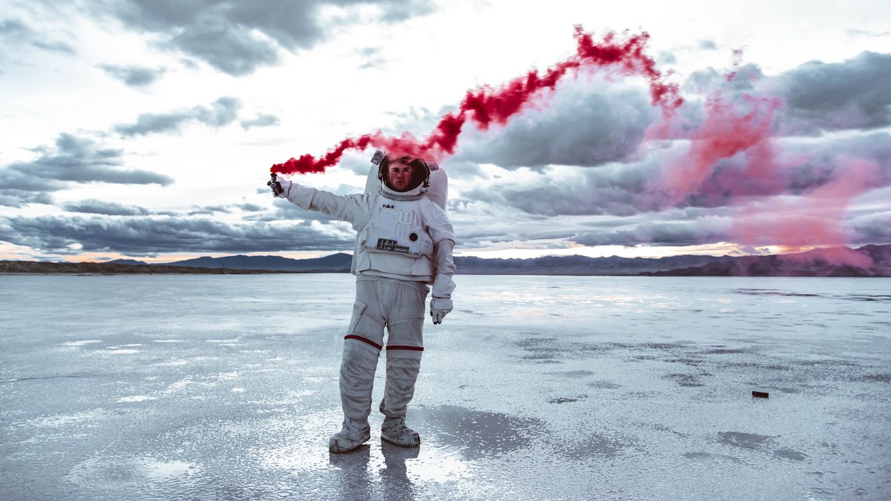 Wallpaper astronaut, spacesuit, colored smoke, sky
