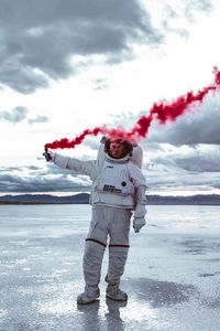 Preview wallpaper astronaut, spacesuit, colored smoke, sky