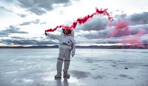 Preview wallpaper astronaut, spacesuit, colored smoke, sky