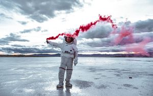 Preview wallpaper astronaut, spacesuit, colored smoke, sky