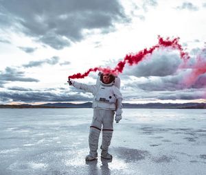Preview wallpaper astronaut, spacesuit, colored smoke, sky